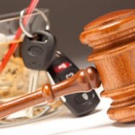 Gavel with a set of keys and an alcoholic drink